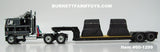Item #60-1299 Black Gray Silver Outline Peterbilt 352 COE 110-inch Sleeper with Turbo Wing and Black Tandem Axle Rogers Vintage Lowboy Trailer with Detachable Neck and Coil Load - 1/64 Scale - DCP by First Gear