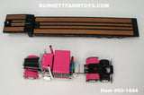 Item #60-1444 Pink Black Peterbilt 379 63-inch Flattop Sleeper with Black Tri-Axle Talbert 5553TA Slide Axle Flatbed Trailer - 1/64 Scale - DCP by First Gear