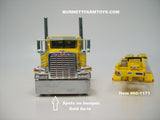 Item #60-1171 Yellow Peterbilt 389 Pride-N-Class 36-inch Flattop Sleeper with Yellow Tri-Axle Fontaine Magnitude Lowboy Trailer with Detachable Neck - 1/64 Scale - DCP by First Gear - Note: Spots on Cab Bumper - Sold As-Is