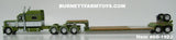 Item #60-1922 Olive Green Metallic White Black Stripe Peterbilt 389 70-inch Mid Roof Sleeper with Olive Green Metallic Tandem Axle Fontaine Renegade Machinery Trailer with Flip Axle - 1/64 Scale – DCP by First Gear
