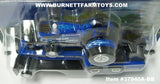 Item #37940A-BB New Holland What In The Blue Blazes Pulling Tractor with Blue Black Pulling Sled - 1/64 Scale - Ertl / Tomy