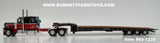 Item #60-1235 Black Red White Stripe Peterbilt 389 63-inch Flattop Sleeper with Black Tri-Axle Talbert 5553TA Slide Axle Flatbed Trailer - 1/64 Scale - DCP
