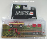 Item #51653-B Red Gold Silver 1987 Lifted GMC K-2500 Pickup Truck with Toolbox and Red Tandem Axle Flatbed Gooseneck Trailer with Ramps - 1/64 Scale - Greenlight