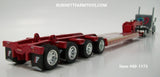 Item #60-1173 Gun Metal Gray Peterbilt 389 Pride-N-Class 36-inch Flattop Sleeper with Red Tri-Axle Fontaine Magnitude Lowboy Trailer with Detachable Neck and Flip Axle - 1/64 Scale - DCP by First Gear