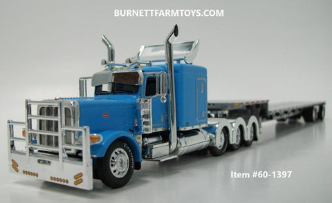Item #60-1397 Baby Blue Tri-Axle Peterbilt 389 63-inch Flattop Sleeper with Turbo Wing and Silver Deck Silver Frame Spread Axle Transcraft Stepdeck Trailer - 1/64 Scale - DCP by First Gear