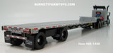 Item #60-1488 Silver Black Tri-Axle Peterbilt 389 63-inch Flattop Sleeper with Turbo Wing and Silver Deck Black Frame Spread Axle Transcraft Stepdeck Trailer - 1/64 Scale - DCP by First Gear