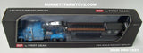 Item #60-1551 Baby Blue Peterbilt 379 63-inch Mid Roof Sleeper with Black Tri-Axle Talbert Lowboy Trailer with Detachable Neck - 1/64 Scale – DCP by First Gear