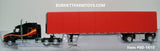 Item #60-1610 Black with Red Orange Yellow Stripe Peterbilt 579 72-inch Mid Roof Sleeper with Red Tarp Spread Axle Utility Roll Tarp Flatbed Trailer - 1/64 Scale - DCP by First Gear