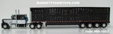 Item #60-1653 Black White Peterbilt 389 63-inch Flattop Sleeper with All Black Quad Axle Wilson Silver Star Livestock Trailer - 1/64 Scale - DCP by First Gear