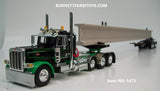 Item #60-1673 Black Green Tri-Axle Peterbilt 389 Day Cab with ERMC 4-axle Hydra-Steer Trailer and Bridge Beam Load - 1/64 Scale - DCP by First Gear