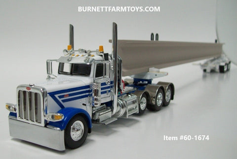 Item #60-1674 White Blue Tri-Axle Peterbilt 389 Day Cab with ERMC 4-axle Hydra-Steer Trailer and Bridge Beam Load - 1/64 Scale - DCP by First Gear