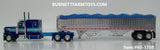 Item #60-1708 Two-Toned Blue Silver Stripe Red Black Outline Peterbilt 389 63-inch Flattop Sleeper with Chrome High Sided Blue Tarp Chrome Silver Frame Tandem Axle Wilson 43-foot Pacesetter Hopper Bottom Grain Trailer - 1/64 Scale - DCP by First Gear