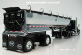 Item #60-1737 Black Peterbilt 389 63-inch Mid Roof Sleeper with Chrome Sided Black Tarp Black Frame Spread Axle MAC Round Dump Trailer - 1/64 Scale – DCP by First Gear
