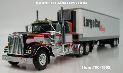 Item #60-1882 Large Car Mag Orange Black White Kenworth W900A 36-inch Flattop Sleeper with White Sided Silver Trim Black Frame Tandem Axle Vintage 40-foot Refrigerated Trailer with Thermo King Refrigerator - 1/64 Scale – DCP by First Gear