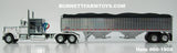 Item #60-1908 White Silver Stripe Peterbilt 359 with 60-inch Vintage Sleeper and Chrome High Sided Black Tarp Silver Frame Tandem Axle Wilson 43-foot Hopper Bottom Grain Trailer - 1/64 Scale – DCP by First Gear