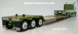 Item #60-1922 Olive Green Metallic White Black Stripe Peterbilt 389 70-inch Mid Roof Sleeper with Olive Green Metallic Tandem Axle Fontaine Renegade Machinery Trailer with Flip Axle - 1/64 Scale – DCP by First Gear