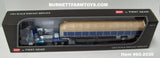 Item #60-2030 Galaxy Blue Tan Peterbilt 379 36-inch Flattop Sleeper with Galaxy Blue Sided Tan Tarp Galaxy Blue Frame Spread Axle Wilson Roadbrute 53-foot Flatbed Covered Wagon Trailer - 1/64 Scale – DCP by First Gear