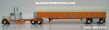 Item #60-2032 White Orange Peterbilt 379 36-inch Flattop Sleeper with Orange Sided Cream Tarp Orange Frame Spread Axle Wilson Roadbrute 53-foot Flatbed Covered Wagon Trailer - 1/64 Scale – DCP by First Gear