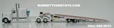Item #60-2033 White Peterbilt 389 63-inch Flattop Sleeper with White Landoll 440 Series Traveling Slide Axle Flatbed Trailer - 1/64 Scale – DCP by First Gear