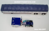 Item #60-2057 Blue White Black Outline Peterbilt 352 COE 110-inch Sleeper with White Sided Blue Tarp Blue Frame Spread Axle Wilson Roadbrute 53-foot Flatbed Covered Wagon Trailer - 1/64 Scale – DCP by First Gear