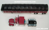 Item #60-2058 Burgundy White Black Outline Peterbilt 389 63-inch Flattop Sleeper with Burgundy Sided Black Tarp Silver Frame Spread Axle Wilson Roadbrute 53-foot Flatbed Covered Wagon Trailer - 1/64 Scale – DCP by First Gear