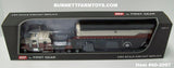 Item #60-2097 Cream Burnt Orange Black Stripe Kenworth W900L 72-inch AeroCab Flattop Sleeper with Cream Burnt Orange Black Sided Black Tarp Black Frame Spread Axle MAC Coal Dump Trailer - 1/64 Scale – DCP by First Gear