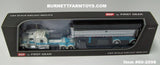 Item #60-2098 Cream Turquoise Kenworth W900L 72-inch AeroCab Flattop Sleeper with Chrome Sided Black Tarp Turquoise Frame Spread Axle MAC Coal Dump Trailer - 1/64 Scale – DCP by First Gear