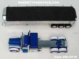 Item #60-2110 Blue Metallic White Peterbilt 389 48-inch Flattop Sleeper with Chrome Sided Black Tarp Silver Frame Tri-Axle MAC Coal Dump Trailer - 1/64 Scale – DCP by First Gear