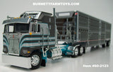 Item #60-2123 Dark Gray Silver Turquoise Kenworth K100 COE Aerodyne Sleeper with Dark Gray Sided Silver Trim Spread Axle Wilson Silver Star Livestock Trailer - 1/64 Scale – DCP by First Gear