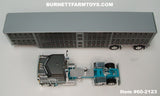 Item #60-2123 Dark Gray Silver Turquoise Kenworth K100 COE Aerodyne Sleeper with Dark Gray Sided Silver Trim Spread Axle Wilson Silver Star Livestock Trailer - 1/64 Scale – DCP by First Gear