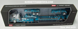 Item #60-2131 Aqua Blue White Tri-Axle Peterbilt 389 36-inch Flattop Sleeper with Aqua Blue Tri-Axle Heavy Haul Fontaine Magnitude Lowboy Trailer with Jeep and Stinger - 1/64 Scale – DCP by First Gear