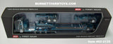 Item #60-2135 Aqua Blue Metallic Black Stripe Silver Outline Peterbilt 389 36-inch Flattop Sleeper with Aqua Blue Metallic Tri-Axle Heavy Haul Fontaine Magnitude Lowboy Trailer with Jeep and Stinger - 1/64 Scale – DCP by First Gear