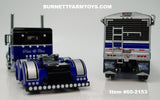 Item #60-2153 Black Blue Silver Peterbilt 389 Pride-N-Class 63-inch Flattop Sleeper with Matching Spread Axle Wilson Pacesetter 50-foot Hopper Bottom Grain Trailer - 1/64 Scale – DCP by First Gear