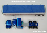 Item #60-2194 Two-Toned Blue Silver Outline Peterbilt 379 48-inch Flattop Sleeper with White High Sided Blue Tarp Silver Frame Tandem Axle Wilson Pacesetter Hopper Bottom Grain Trailer - 1/64 Scale – DCP by First Gear