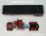 Item #60-2199 Burnt Orange Metallic Silver Black Outline Peterbilt 379 48-inch Flattop Sleeper with Black High Sided Black Tarp Silver Frame Tandem Axle Wilson 43-foot Pacesetter Hopper Bottom Grain Trailer - 1/64 Scale – DCP by First Gear
