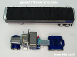 Item #60-2200 Gun Metal Gray Metallic Blue Metallic Peterbilt 379 48-inch Flattop Sleeper with Gun Metal Gray Blue High Sided Black Tarp Silver Frame Tandem Axle Wilson 43-foot Pacesetter Hopper Bottom Grain Trailer - 1/64 Scale – DCP by First Gear