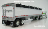 Item #60-2202 White Green Stripe Lime Green Gold Outline Peterbilt 379 48-inch Flattop Sleeper with White High Sided Black Tarp Silver Frame Tandem Axle Wilson 43-foot Pacesetter Hopper Bottom Grain Trailer - 1/64 Scale - DCP by First Gear
