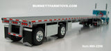 Item #60-2206 White Turquoise Peterbilt 379 36-inch Flattop Sleeper with Silver Deck Black Frame Spread Axle Wilson Roadbrute 53-foot Flatbed Trailer - 1/64 Scale – DCP by First Gear