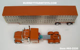 Item #60-2220 Southern Custom Diecast Burnt Orange Cream Peterbilt 589 72-inch Flattop Sleeper with Silver Sided Burnt Orange Trim Cream End Caps Spread Axle Wilson Silver Star Livestock Trailer - 1/64 Scale – DCP by First Gear