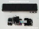 Item #60-2236 Black GMC General 34-foot Flattop Sleeper with Black Sided Black Tarp Silver Frame Tandem Axle Wilson 43-foot Pacesetter Hopper Bottom Grain Trailer - 1/64 Scale – DCP by First Gear