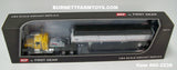 Item #60-2238 Yellow Black Fender GMC General 34-foot Flattop Sleeper with White Sided Black Tarp Silver Frame Tandem Axle Wilson Pacesetter 43-foot Hopper Bottom Grain Trailer - 1/64 Scale – DCP by First Gear