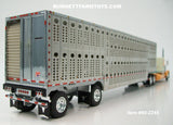 Item #60-2245 Peach Teal Cream Peterbilt 389 48-inch Flattop Sleeper with Silver Spread Axle Wilson Silver Star Livestock Trailer - 1/64 Scale – DCP by First Gear