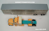 Item #60-2245 Peach Teal Cream Peterbilt 389 48-inch Flattop Sleeper with Silver Spread Axle Wilson Silver Star Livestock Trailer - 1/64 Scale – DCP by First Gear