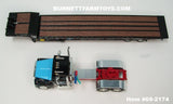Item #69-2174 Capello Heavy Haul Transport Black Red Blue Ford LTL 9000 Day Cab with Black Tandem Axle Landoll 440B-50CA Traveling Slide Axle Flatbed Trailer - Legacy Series #3 - 1/64 Scale – DCP by First Gear