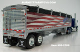 Item #69-2366 Blue Peterbilt 389 48-inch Flattop Sleeper with American Flag High Sided Black Tarp Silver Frame Tandem Axle Wilson Pacesetter 43-foot Hopper Bottom Grain Trailer - USA 250 Year Anniversary Edition - 1/64 Scale – DCP by First Gear