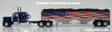 Item #69-2366 Blue Peterbilt 389 48-inch Flattop Sleeper with American Flag High Sided Black Tarp Silver Frame Tandem Axle Wilson Pacesetter 43-foot Hopper Bottom Grain Trailer - USA 250 Year Anniversary Edition - 1/64 Scale – DCP by First Gear