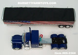 Item #69-2366 Blue Peterbilt 389 48-inch Flattop Sleeper with American Flag High Sided Black Tarp Silver Frame Tandem Axle Wilson Pacesetter 43-foot Hopper Bottom Grain Trailer - USA 250 Year Anniversary Edition - 1/64 Scale – DCP by First Gear