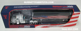 Item #69-2368 White Peterbilt 389 48-inch Flattop Sleeper with American Flag High Sided Black Tarp Silver Frame Tandem Axle Wilson Pacesetter 43-foot Hopper Bottom Grain Trailer - USA 250 Year Anniversary Edition - 1/64 Scale – DCP by First Gear