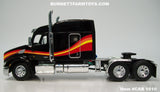 Item #CAB 1610 Black with Red Orange Yellow Stripe Peterbilt 579 72-inch Mid Roof Sleeper - 1/64 Scale – DCP by First Gear