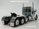 Item #CAB 1962 White Black Gold Outline Tri-Axle Kenworth W990 Day Cab with Enclosed Headache Rack - 1/64 Scale – DCP by First Gear